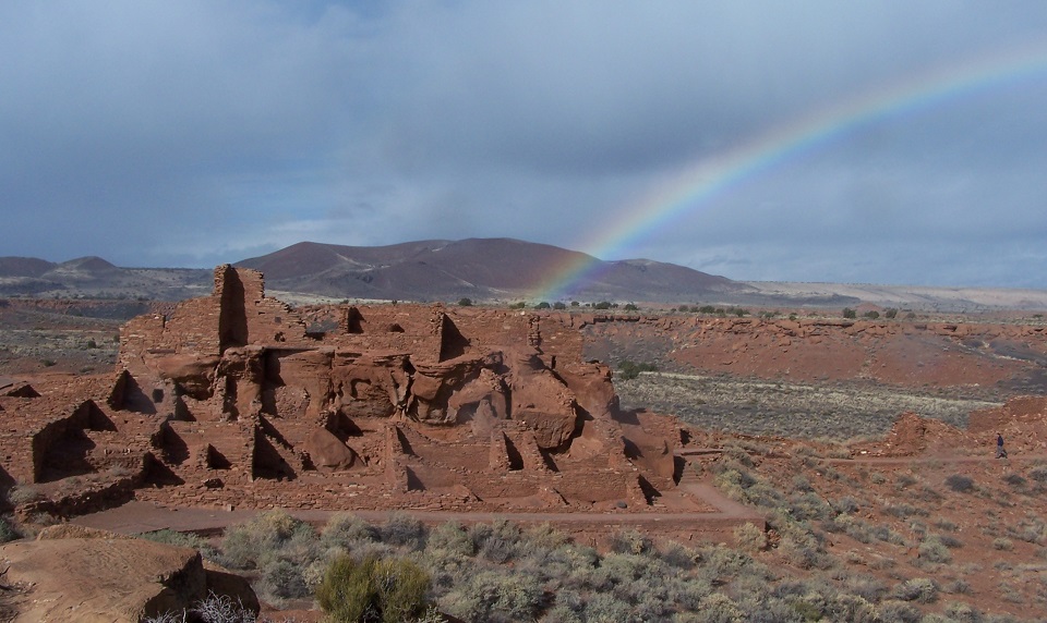 Rainbow over pueblo in the desert