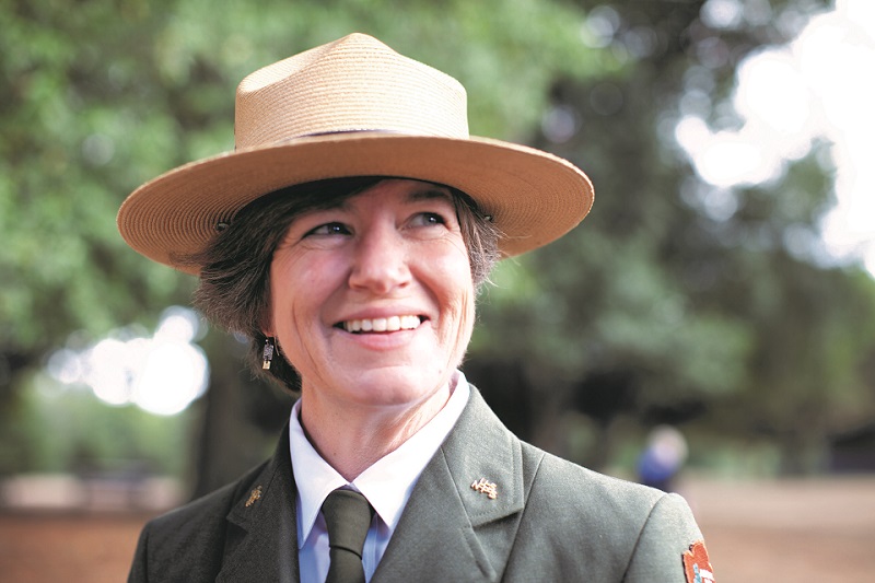 Cicely Muldoon in uniform with blurred trees in the background