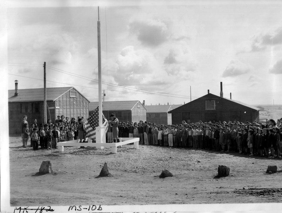 ddr-densho-37-719-mezzanine-dcee934528-a Historical black and white photo of incarcerated Japanese American children in front of a school building