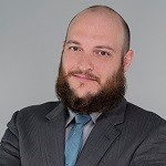 Edelstein headshot A man in suit and tie looks at the camera