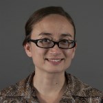 Headshot of a woman in glasses.