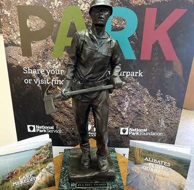 Pulaski Award with books and Find Your Park banner.