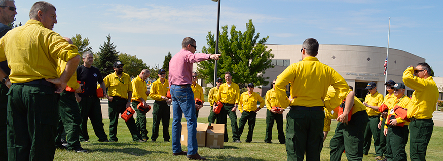 NPS Wildland Fire Training Manager Jim Shultz leads a practice fire shelter training with fire managers.