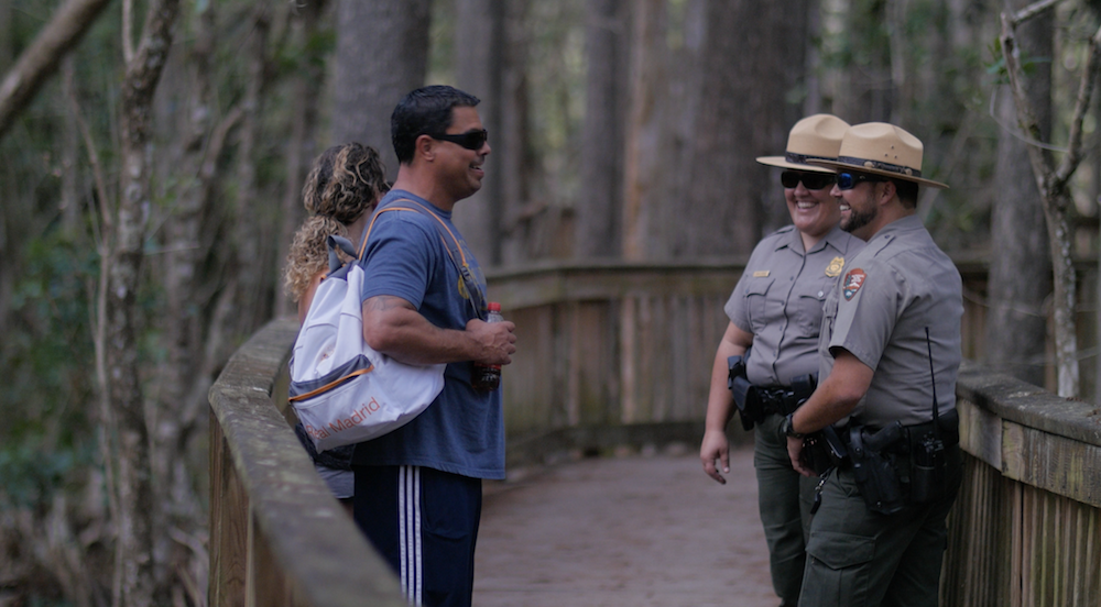 rangers_public Two law enforcement rangers having a conversation with two park visitors.