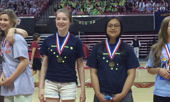 Two high-school National History Day winners from Alaska wearing their medals. Two high-school National History Day winners from Alaska wearing their medals.