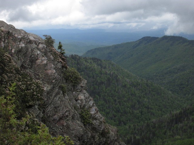 Clouds over green mountains