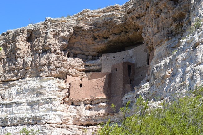 Cliff dwellings carved into sandstone.