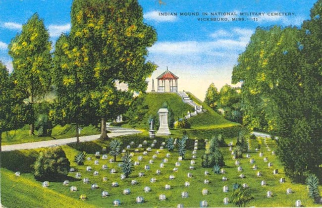 Painting showing a green field with white headstones, trees, and a white pergola on a hill.