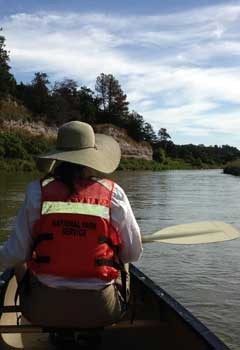 Scientist oaring in row boat