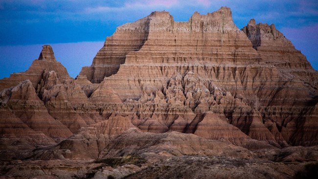 striped brown cliffs and heavy erosion