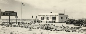 A historic image of a small adobe building in the desert.
