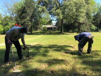 SEAC archeologists using metal detectors at a historic home SEAC archeologists using metal detectors at a historic home
