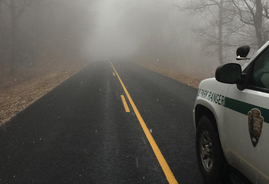 A federal grand jury has issued a superseding indictment charging Derek Shawn Pendergraft, age 21, with First Degree Murder and Aggravated Sexual Abuse in the death of a coworker within Blue Ridge Parkway. A US Park Ranger vehicle is stopped on a foggy roadway along the Blue Ridge Parkway. NPS photo.