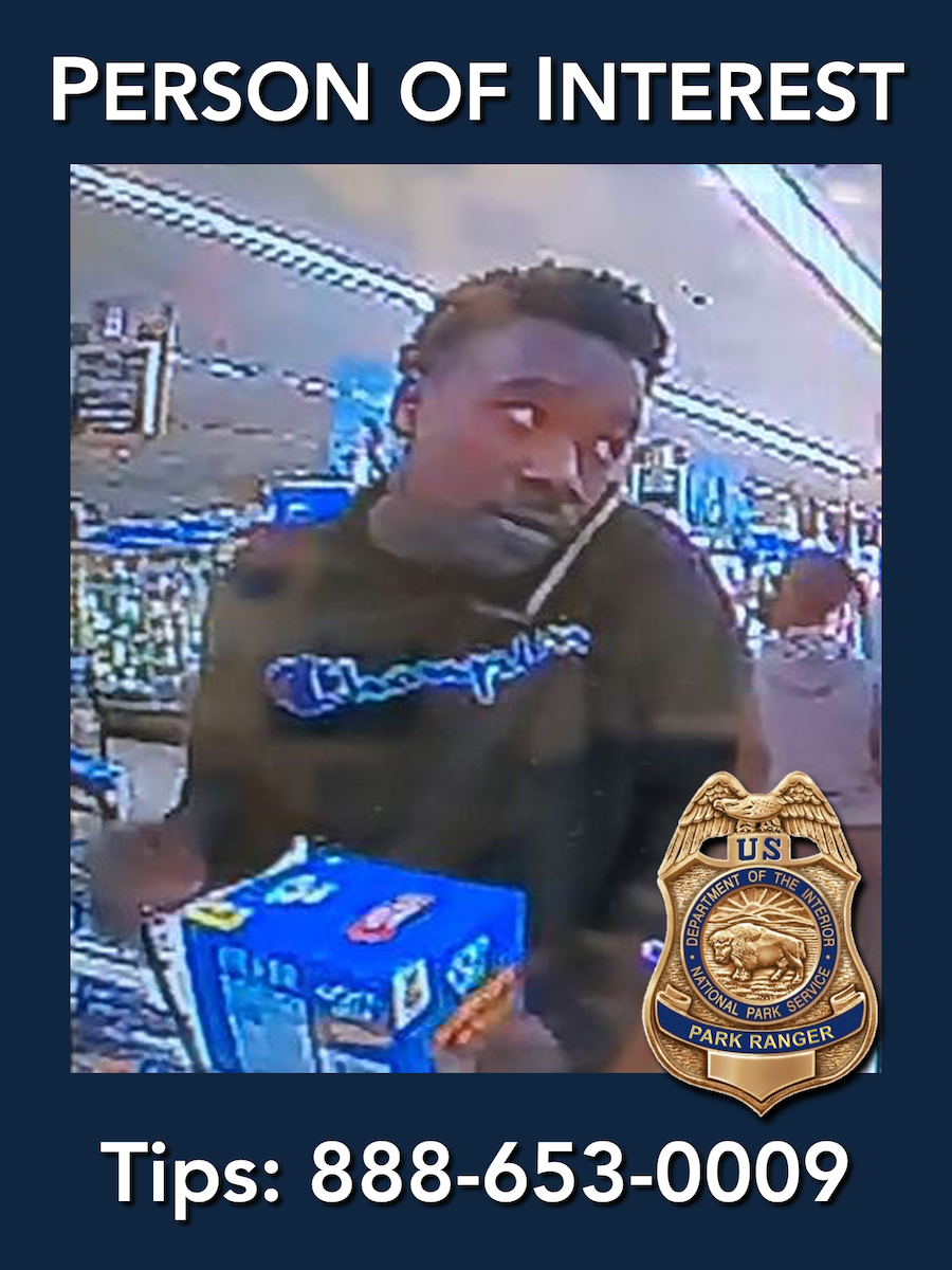 The National Park Service is seeking tips from the public to identify a person of interest in a vehicle burglary investigation. The person is a black male approximately 20-30 years old, last seen wearing a black "Champion" sweatshirt.