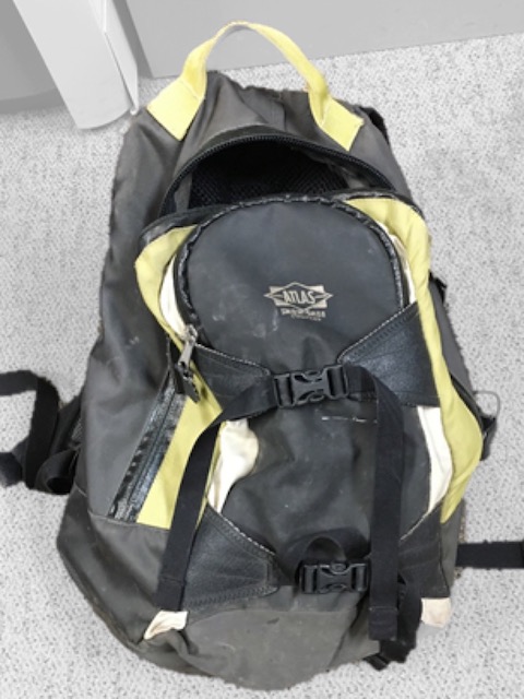 A black backpack with yellow-green trim was left behind by the assailant. NPS image. A black backpack with yellow-green trim was left behind by the assailant. NPS image.