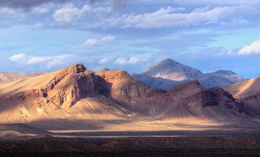 Cameron and Schyler Thomas have been sentenced to prison for their involvement in a January 2018 road rage incident in Lake Mead National Recreation Area. Barren mountains rise out of the desert under a partly-cloudy sky. NPS photo of the Muddy Mountain Wilderness in Lake Mead National Recreation Area.
