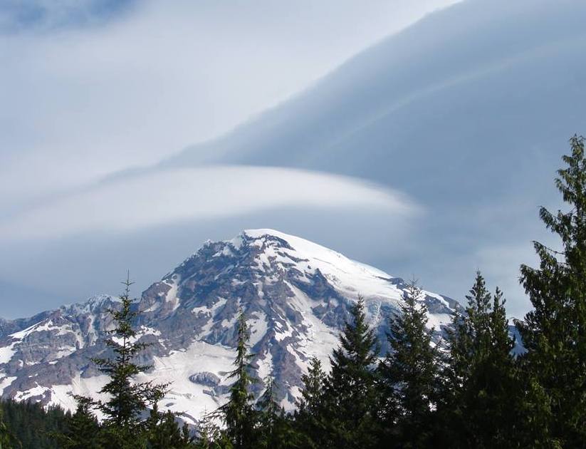 Lenticular clouds appear over the summit of Mount Rainier. NPS photo by S Redman.