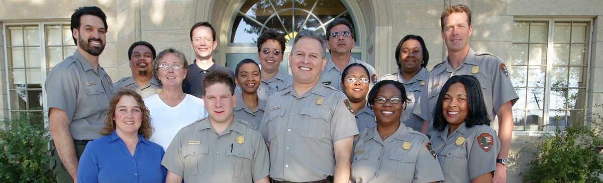 A diverse workforce helps raise awareness of cultural worldview and attitudes towards cultural differences. NPS photo of employees grouped outside a building at Harpers Ferry National Historical Park. A diverse workforce helps raise awareness of cultural worldview and attitudes towards cultural differences. NPS photo of employees grouped outside a building at Harpers Ferry National Historical Park.