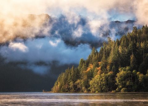 Sunrise lights clouds above Lake Crescent in Olympic National Park. NPS photo by G Longenbaugh.