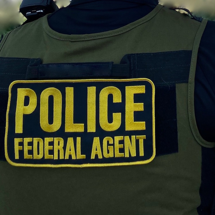 A close-up of a vest worn by a Special Agent of the National Park Service Investigative Services Branch. The words "Police, Federal Agent" are embroidered across the back. NPS photo. A close-up of a vest worn by a Special Agent of the National Park Service Investigative Services Branch. The words "Police, Federal Agent" are embroidered across the back. NPS photo.