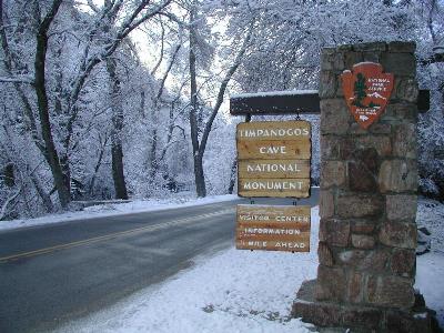 The entrance to Timpanogos Cave National Monument blanketed by a light layer of snow. Vandals recently damaged historic buildings and stole emergency response equipment. NPS photo.