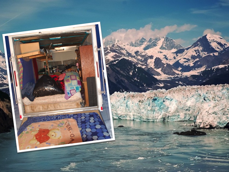 Background photo of snowcapped peaks rising above a glacier and frozen waterway, with an inset photo of a box trailer with miscellaneous items where the suspect was located.
