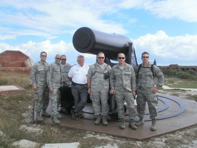 Retirees and active-duty reservists standing in front of a 25-ton Rodman gun Retirees and active-duty reservists standing in front of a 25-ton Rodman gun