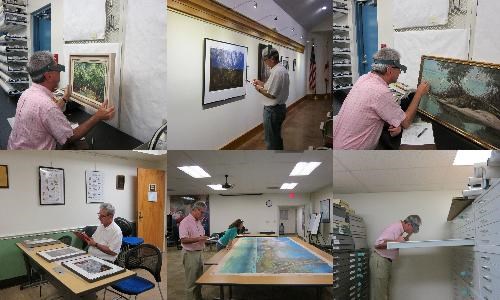 Conservator James Swope conducting artwork collection condition survey