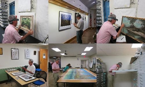 Conservator James Swope conducting artwork collection condition survey Conservator James Swope conducting artwork collection condition survey