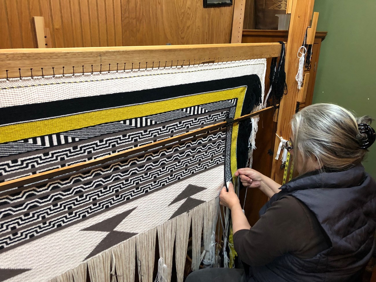 Lani weaving Generations Robe November 2018 Documenting Klukwan's Woolen Weaving Traditions -- An Oral History and Documenting Cultural Traditions Project
