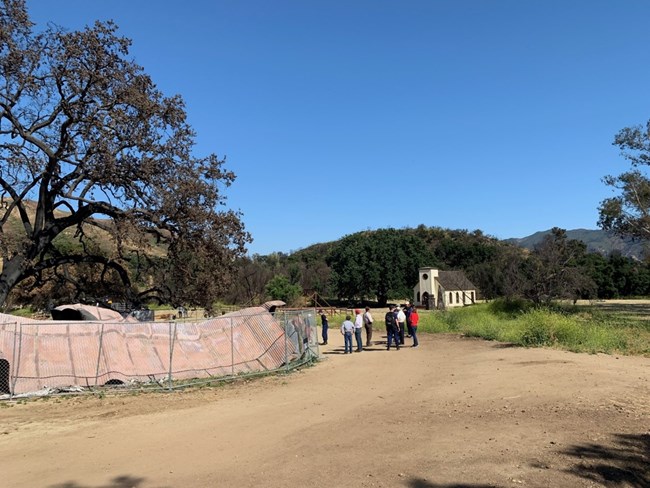 A group of people tour a site within Santa Monica Mountains National Recreation Area.