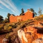 A brick building sitting on a rise.