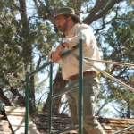 Randy Skeirik A man in uniform stands on scaffolding.