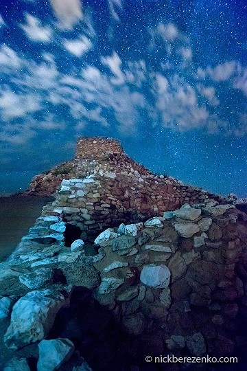 Tuzigoot at Night by Berezenko Stone walls with bluish tint and starry sky and clouds above
