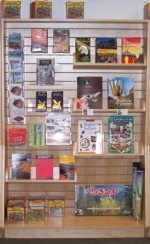 Bookshelves with books, postcards, gifts.