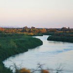 A wide river with low green banks.