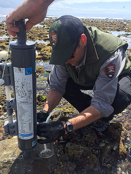 Scientist collecting water sample