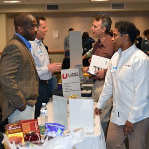 DSC employees visiting with vendors at the small business fair. DSC employees visiting with vendors at the small business fair.