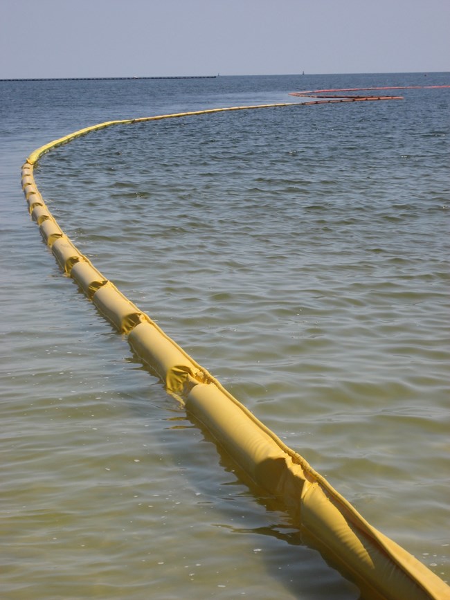 A boom is deployed during spill response on the ocean.