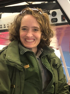Lindy Mihata, new Associate Regional Director for Operations, Interior Region 11, Alaska. A woman is smiling at the camera. She has mid-length brown hair, is wearing an NPS uniform, and has sunglasses propped on her head.