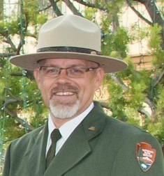 portrait style photo of a park ranger in uniform
