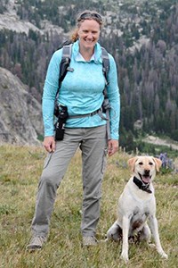 woman hiking with a dog woman hiking with a dog