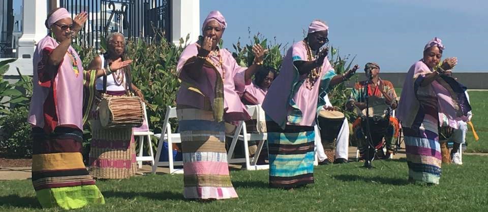 African-American dancers and drummers in colorful garb perform at Fort Monroe African-American dancers and drummers in colorful garb perform at Fort Monroe