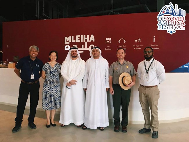 2018 Dubai NPS Public Information Officer Jeremy Barnum (second from right) with government officials.