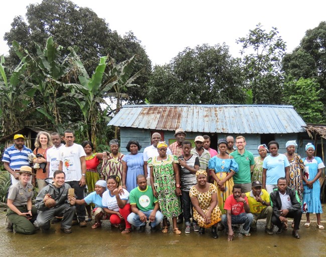 Superintendent Burghart. Superintendent Burghart poses with townspeople at a small village in Equatorial Guinea.