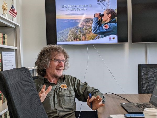 Acting Chief Executive of  the National Parks and Wildlife Service of New South  Wales in Australia, Atticus Fleming, answers a question during a meeting.