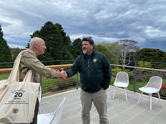 NPS Director Chuck Sams introduces himself to an Australian park official.