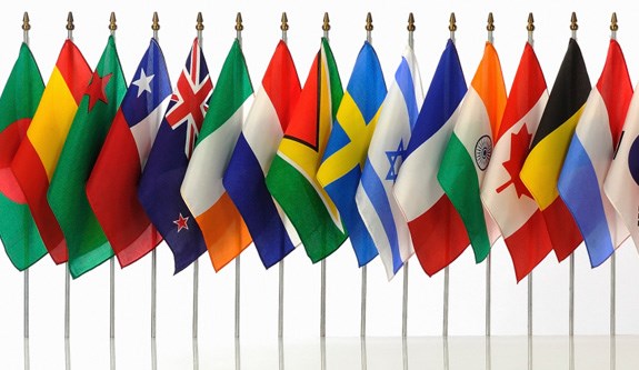 A row of colorful flags from different countries. A row of colorful flags from different countries.