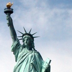 A close up of the top section of the Statue of Liberty.