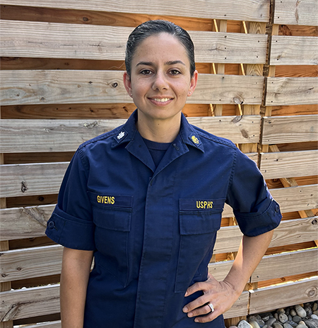 Alyssa Givens Person stands in uniform smiling for the camera.